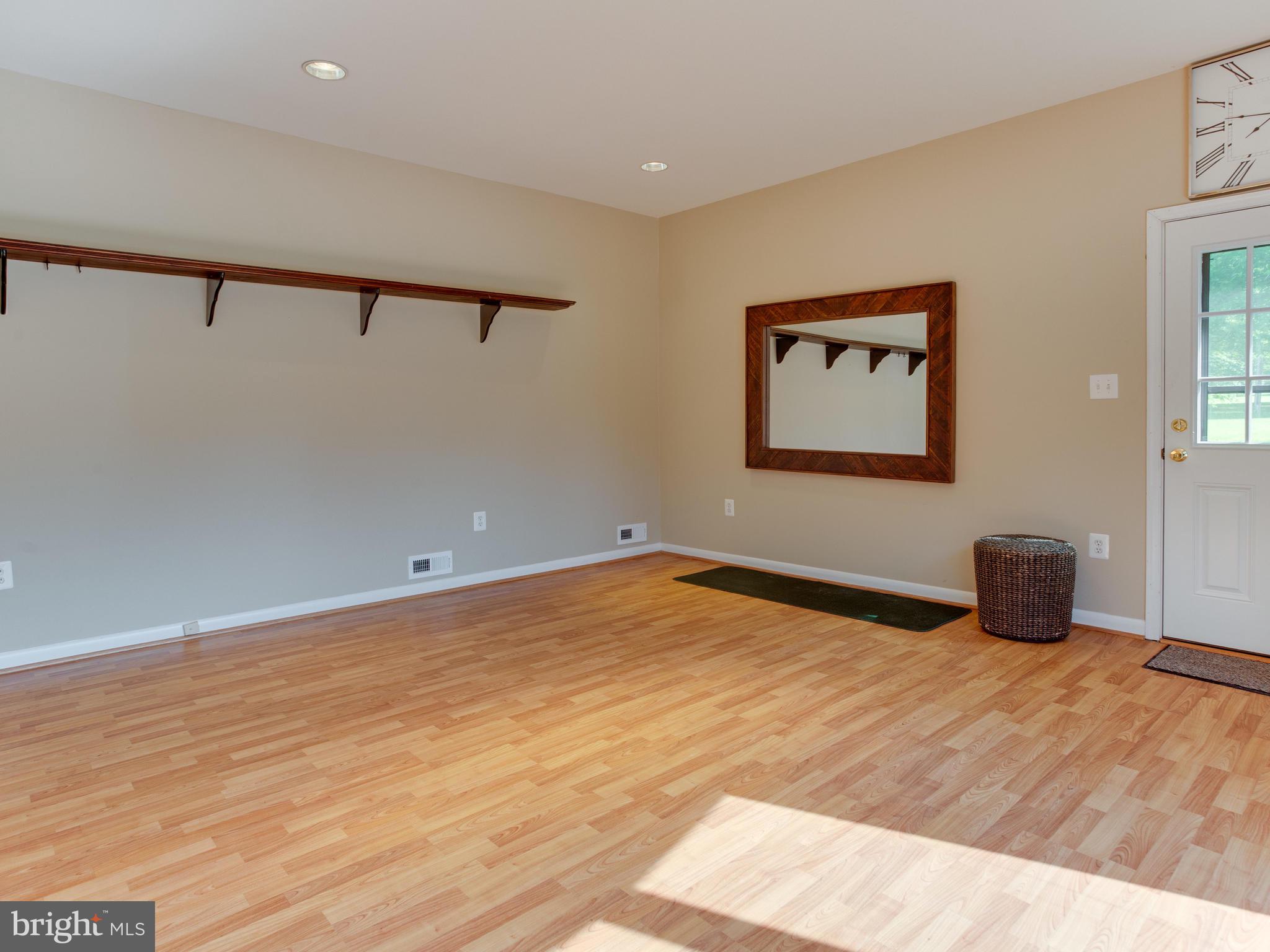 3100 Holland Cliffs Road Huntingtown, MD 20639 - Photo 13 of 44 a view of a room with wooden floor and window