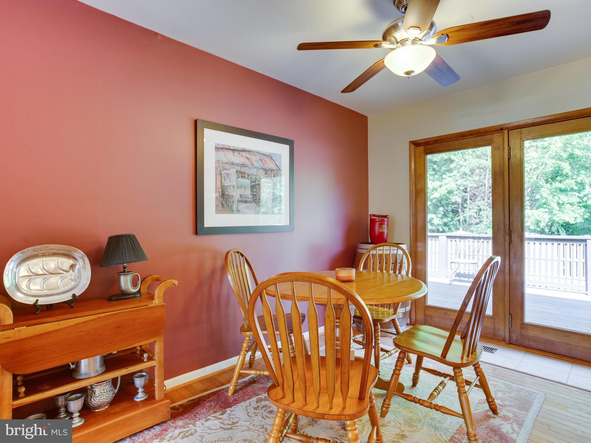3100 Holland Cliffs Road Huntingtown, MD 20639 - Photo 15 of 44 a dining room with furniture and window