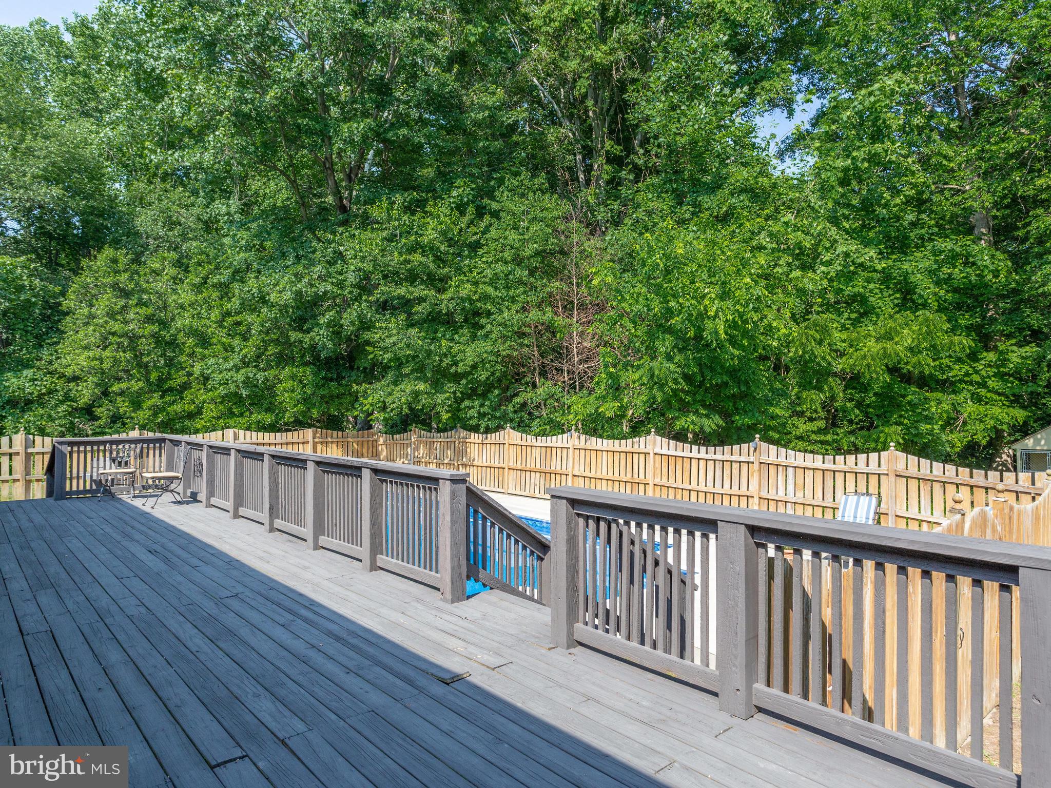 3100 Holland Cliffs Road Huntingtown, MD 20639 - Photo 18 of 44 a balcony with wooden floor and fence