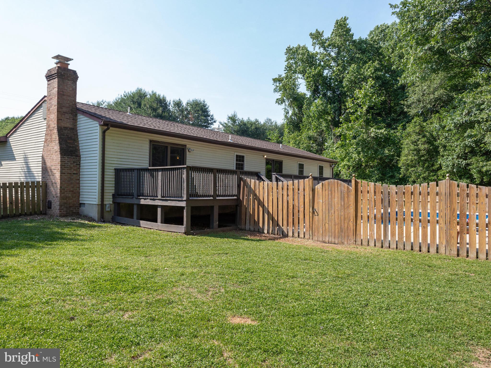 3100 Holland Cliffs Road Huntingtown, MD 20639 - Photo 36 of 44 a view of a house with backyard and sitting area