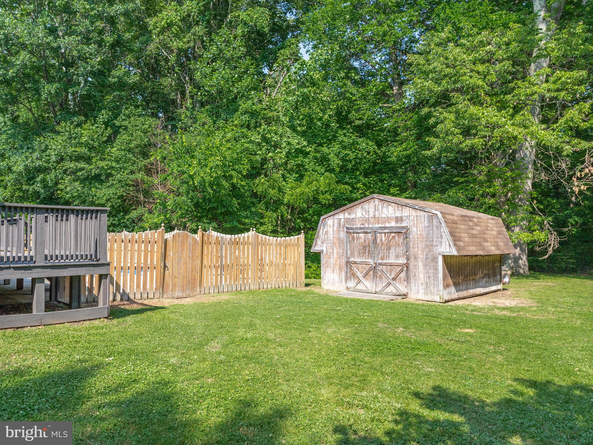 3100 Holland Cliffs Road Huntingtown, MD 20639 - Photo 37 of 44 a view of a house with a yard and sitting area