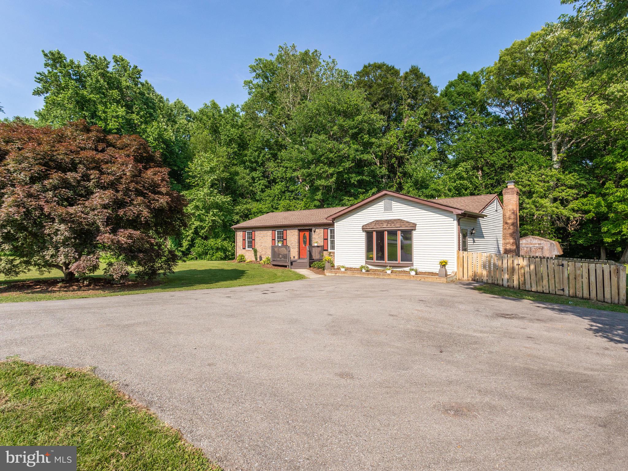 3100 Holland Cliffs Road Huntingtown, MD 20639 - Photo 40 of 44 a house with trees in the background