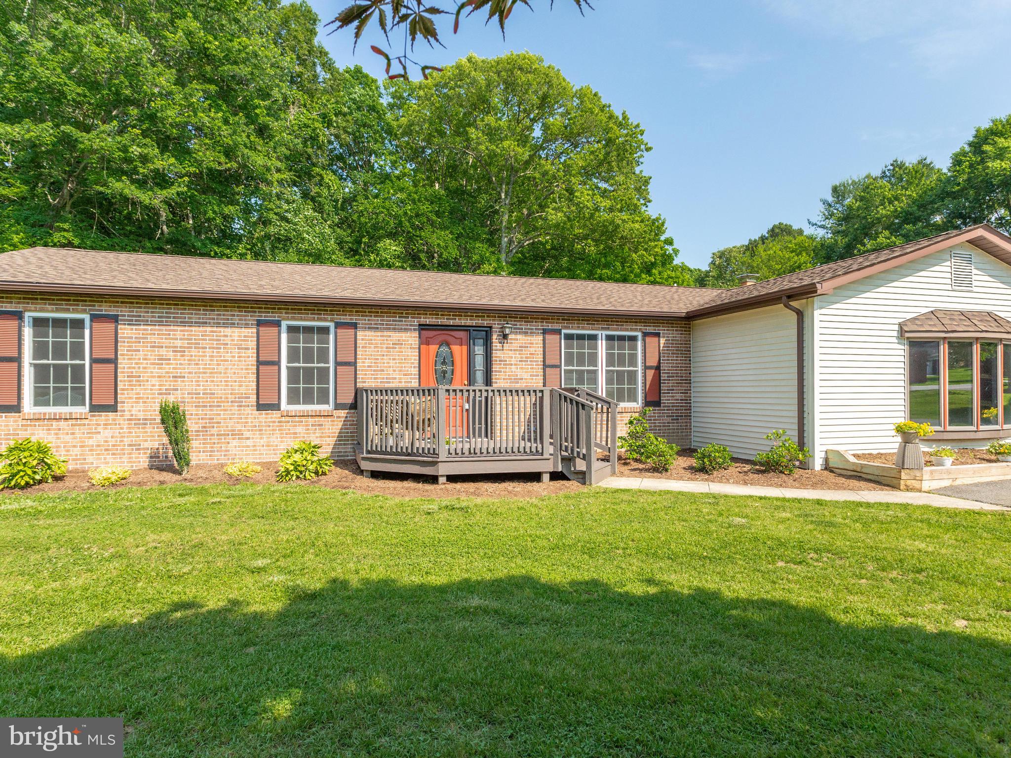 3100 Holland Cliffs Road Huntingtown, MD 20639 - Photo 42 of 44 a backyard of a house with yard table and chairs