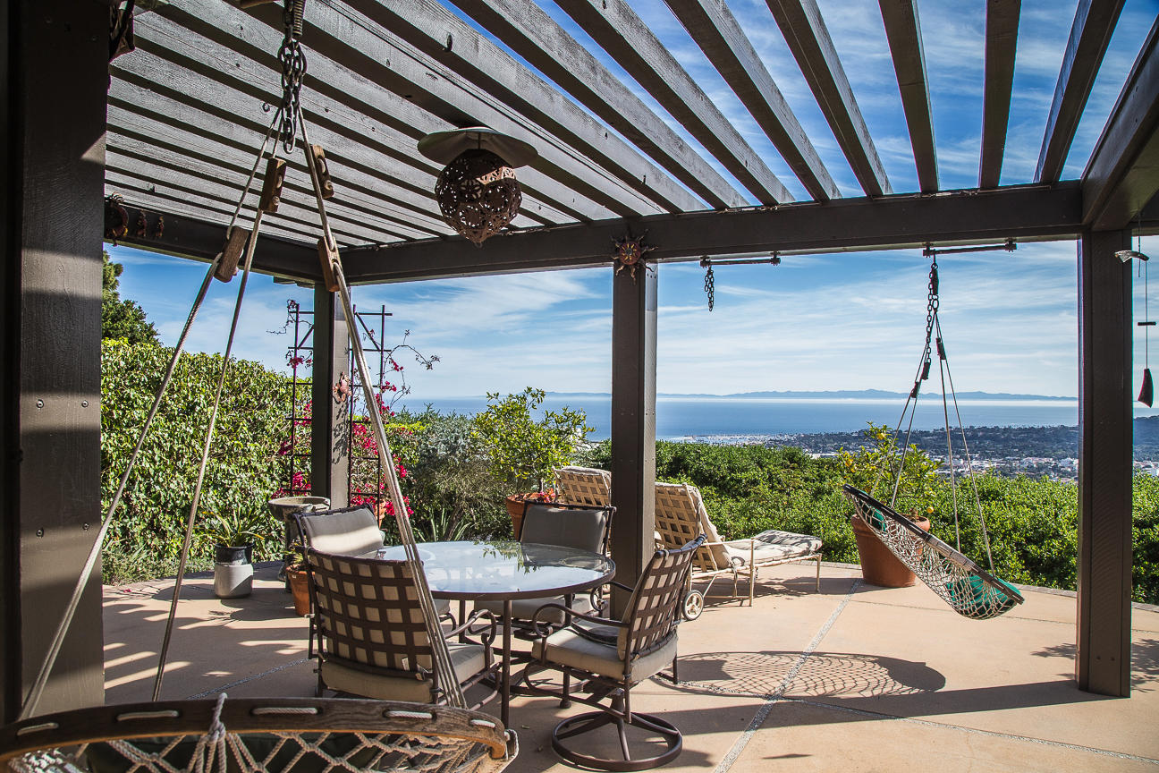 1213 Viscaino Road Santa Barbara, CA 93103 - Photo 13 of 22 a patio with table and chairs and potted plants
