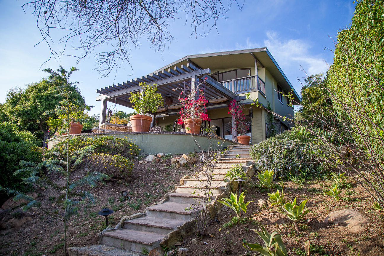 1213 Viscaino Road Santa Barbara, CA 93103 - Photo 14 of 22 a front view of a house with a yard