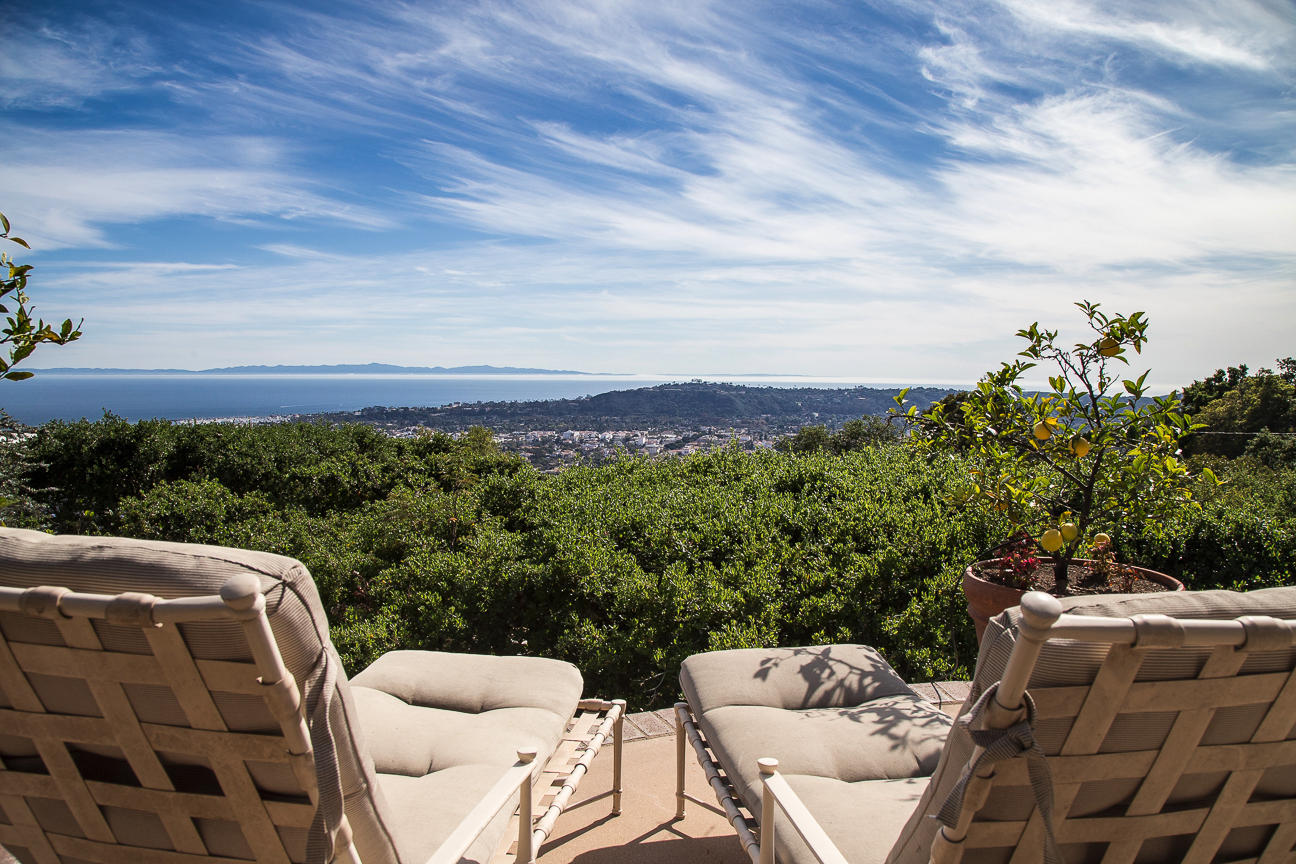 1213 Viscaino Road Santa Barbara, CA 93103 - Photo 21 of 22 a view of a balcony with two chairs and a table