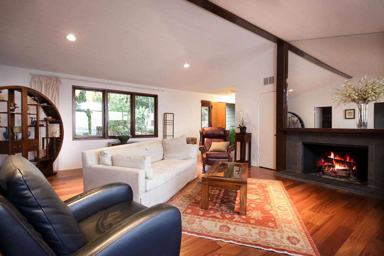1213 Viscaino Road Santa Barbara, CA 93103 - Photo 4 of 22 a living room with furniture and a fireplace