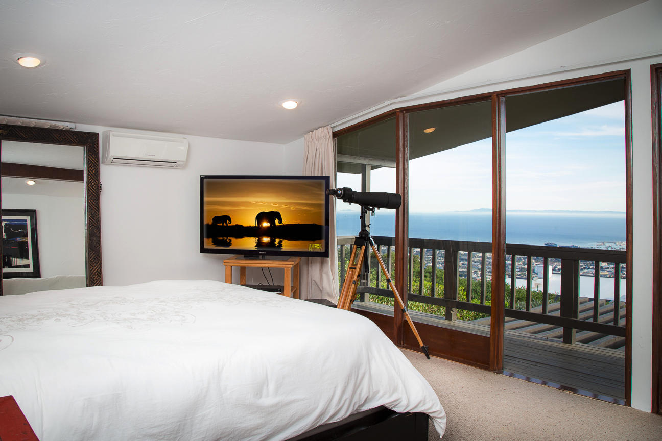 1213 Viscaino Road Santa Barbara, CA 93103 - Photo 7 of 22 a bedroom with a large bed and a tv