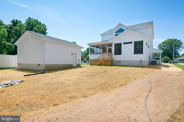 a view of a house with snow on the road
