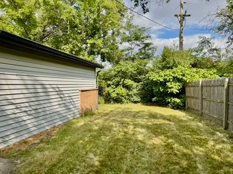 a view of a backyard of the house