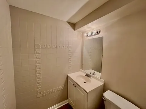 a bathroom with a sink and toilet