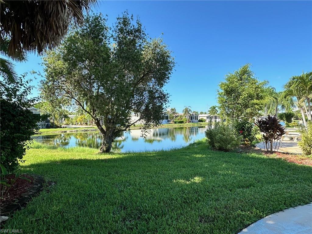 1313 Nickel Lake Point Naples, FL 34114 - Photo 6 of 10 View of green lawn featuring a water view