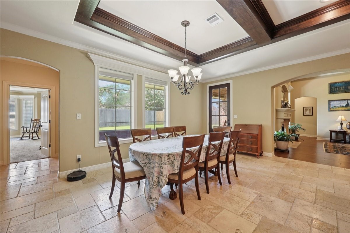 404 Birch View Drive Lumberton, TX 77657 - Photo 11 of 44 a view of a dining room with furniture and chandelier