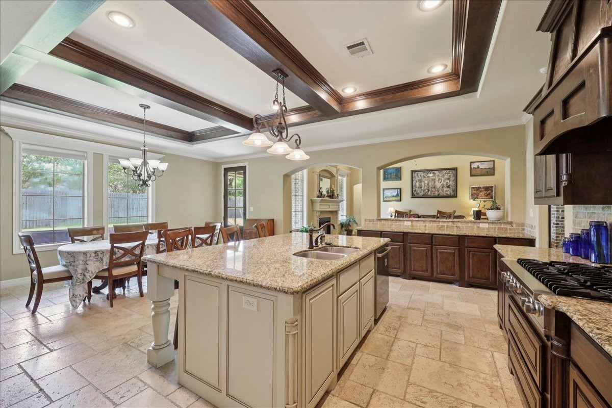 404 Birch View Drive Lumberton, TX 77657 - Photo 16 of 44 a large kitchen with kitchen island a sink table and chairs