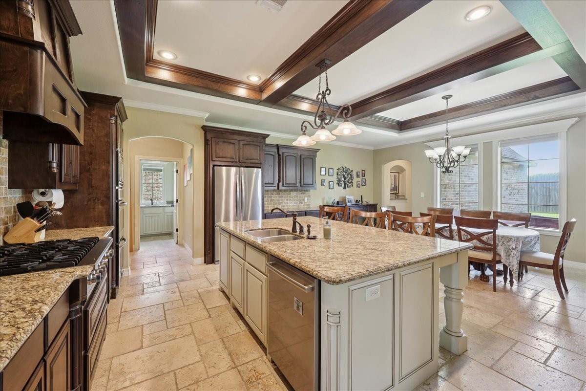 404 Birch View Drive Lumberton, TX 77657 - Photo 17 of 44 a large kitchen with a table and chairs