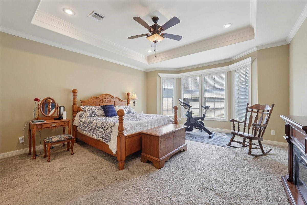 404 Birch View Drive Lumberton, TX 77657 - Photo 18 of 44 a bedroom with furniture and a ceiling fan