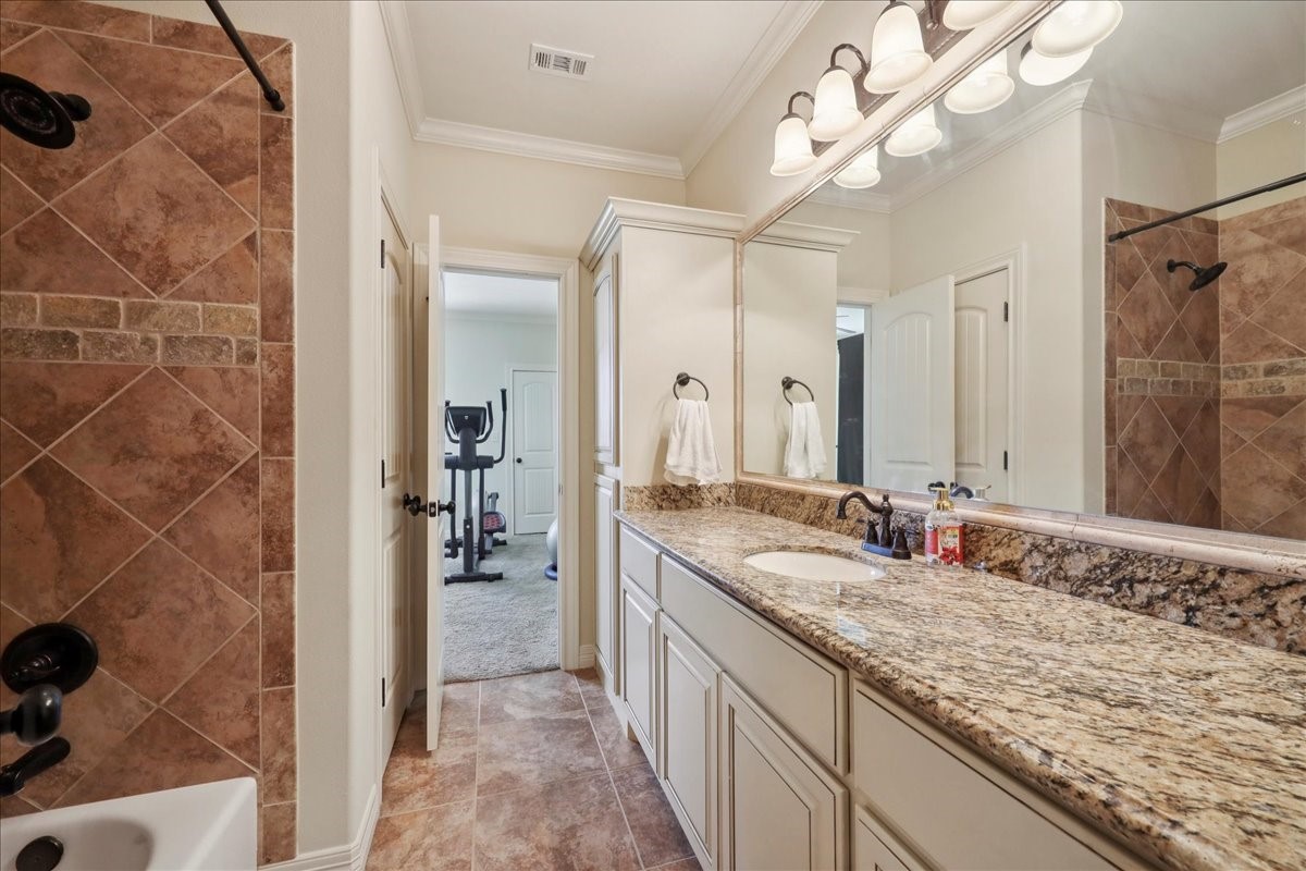 404 Birch View Drive Lumberton, TX 77657 - Photo 20 of 44 a bathroom with a granite countertop sink and a mirror