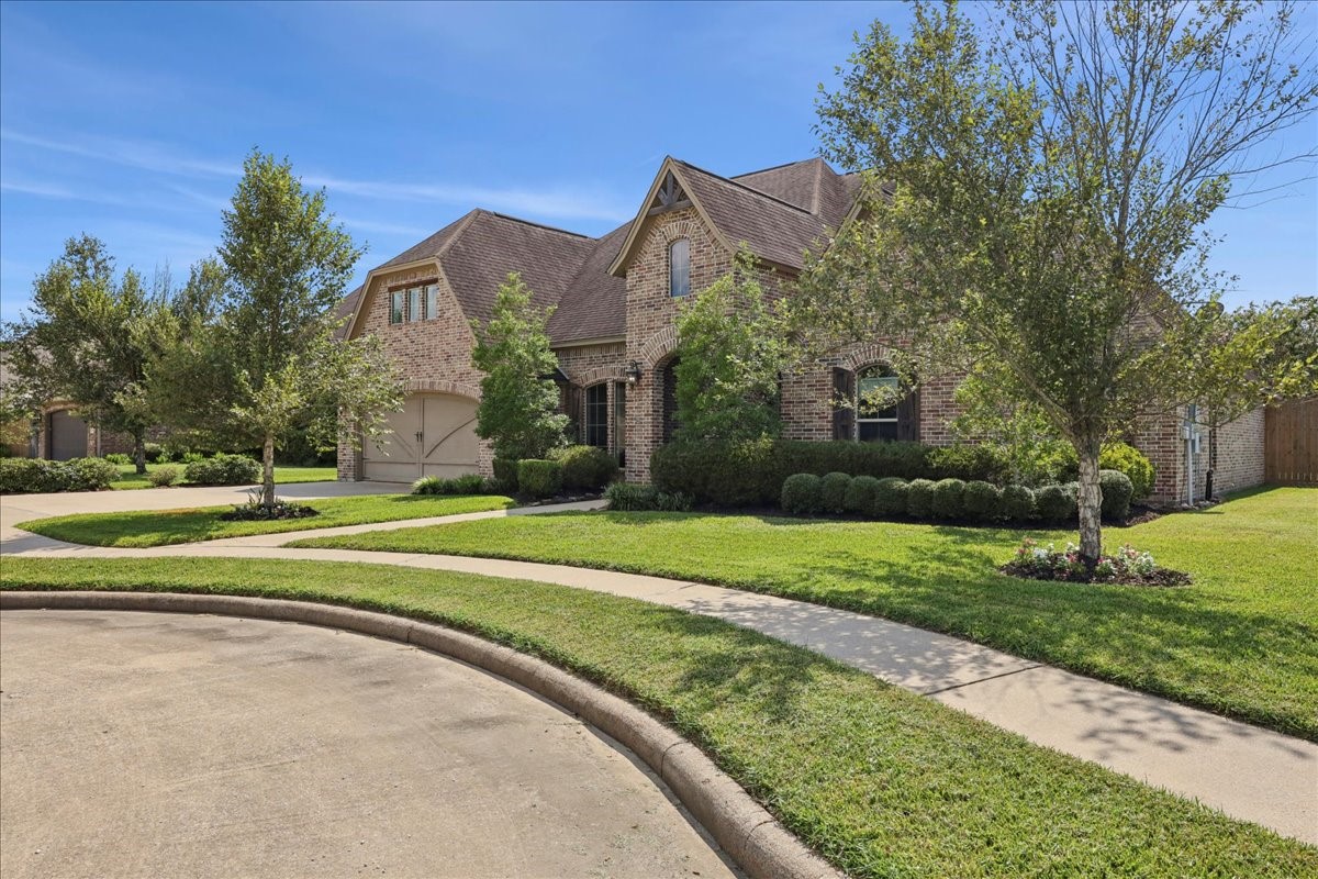 404 Birch View Drive Lumberton, TX 77657 - Photo 2 of 44 a view of a house with a big yard and large trees