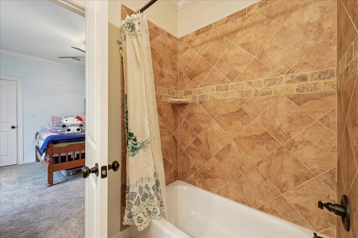 404 Birch View Drive Lumberton, TX 77657 - Photo 26 of 44 a bathroom with a tub and shower