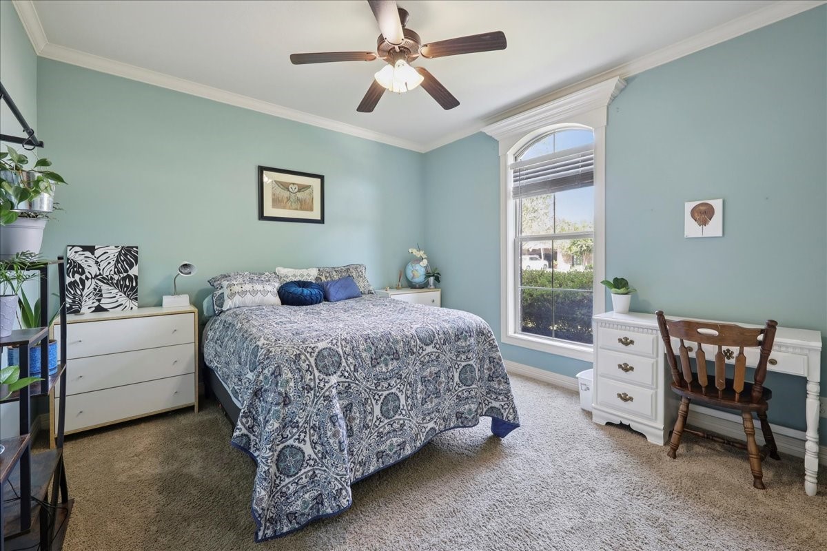 404 Birch View Drive Lumberton, TX 77657 - Photo 29 of 44 a bedroom with a bed and a chair