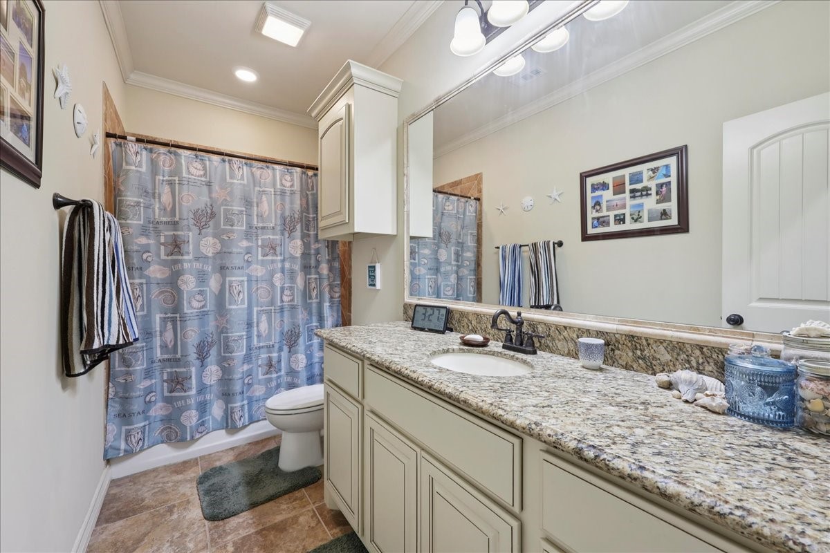 404 Birch View Drive Lumberton, TX 77657 - Photo 31 of 44 a bathroom with a granite countertop sink toilet and shower