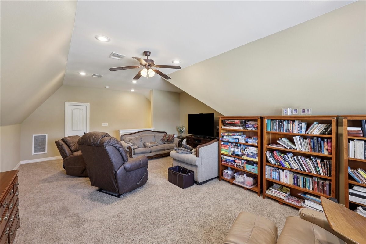 404 Birch View Drive Lumberton, TX 77657 - Photo 38 of 44 a living room with furniture and a flat screen tv