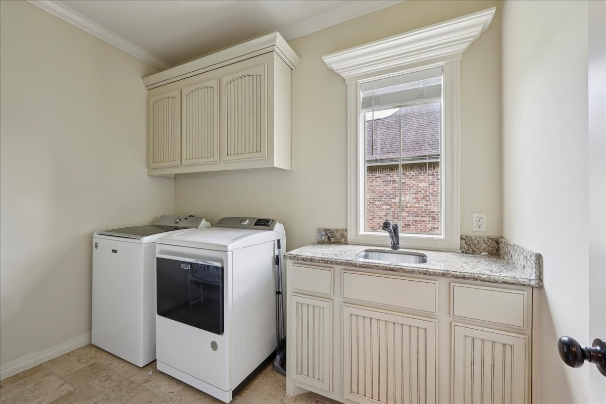 404 Birch View Drive Lumberton, TX 77657 - Photo 40 of 44 a utility room with cabinets washer and dryer