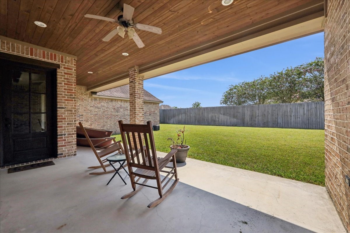 404 Birch View Drive Lumberton, TX 77657 - Photo 41 of 44 a view of a patio with a table and chairs