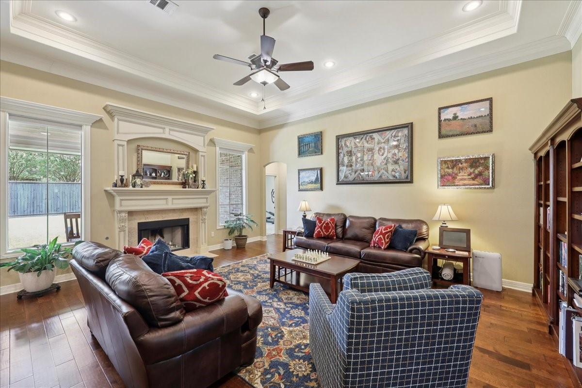 404 Birch View Drive Lumberton, TX 77657 - Photo 5 of 44 a living room with furniture a fireplace and wooden floor