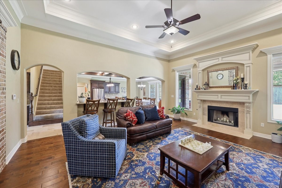 404 Birch View Drive Lumberton, TX 77657 - Photo 8 of 44 a living room with furniture a fireplace and a chandelier