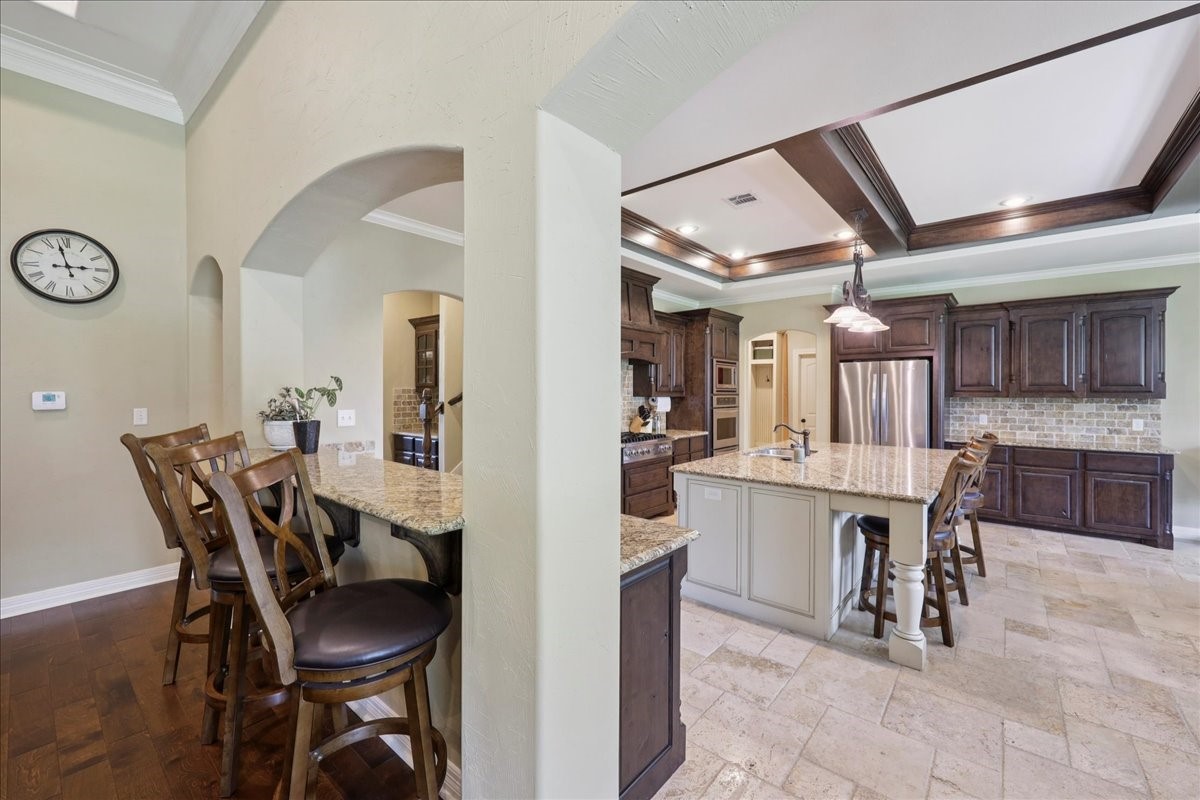 404 Birch View Drive Lumberton, TX 77657 - Photo 9 of 44 a view of a dining area with furniture and a chandelier