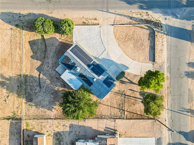 an aerial view of a house with a garden