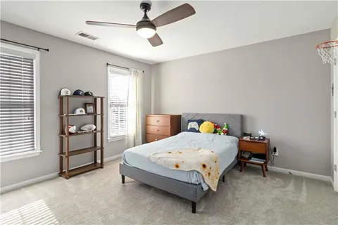 a view of a livingroom with furniture and a flat screen tv