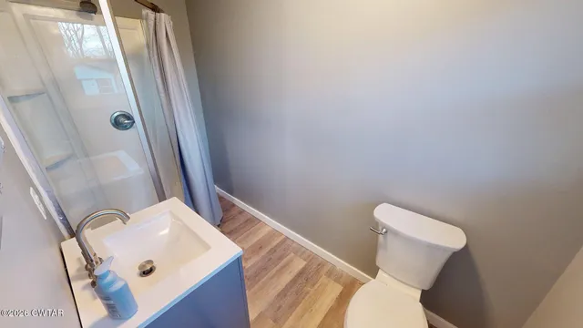 a bathroom with a sink and toilet
