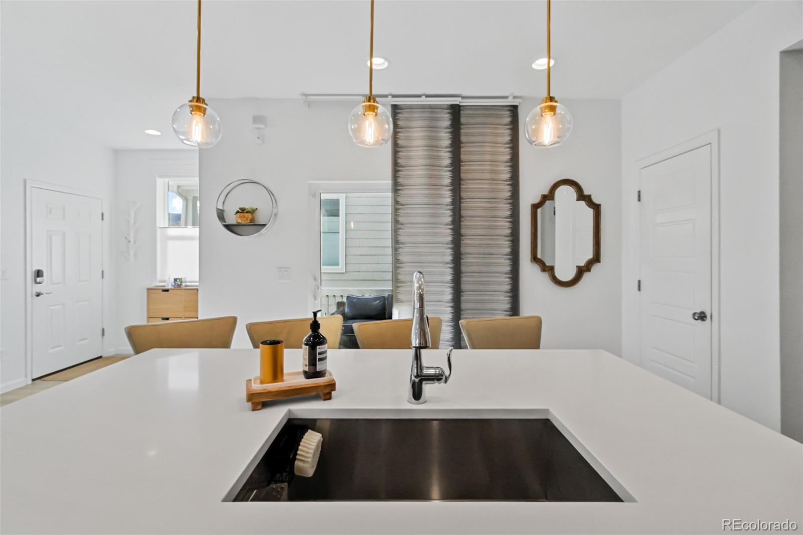 9753 Middle Peak Street Littleton, CO 80125 - Photo 12 of 41 a picture of a living room and a bathroom