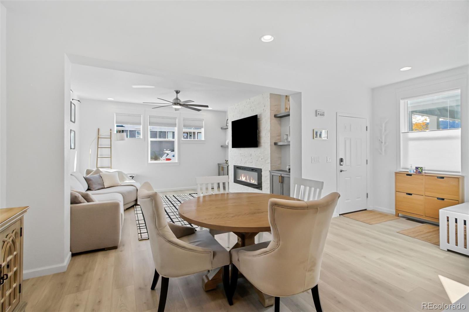 9753 Middle Peak Street Littleton, CO 80125 - Photo 13 of 41 a view of a dining room with furniture and wooden floor