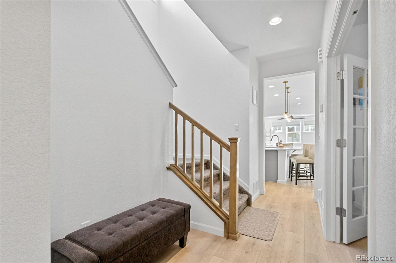 9753 Middle Peak Street Littleton, CO 80125 - Photo 16 of 41 a view of livingroom with furniture and stairs