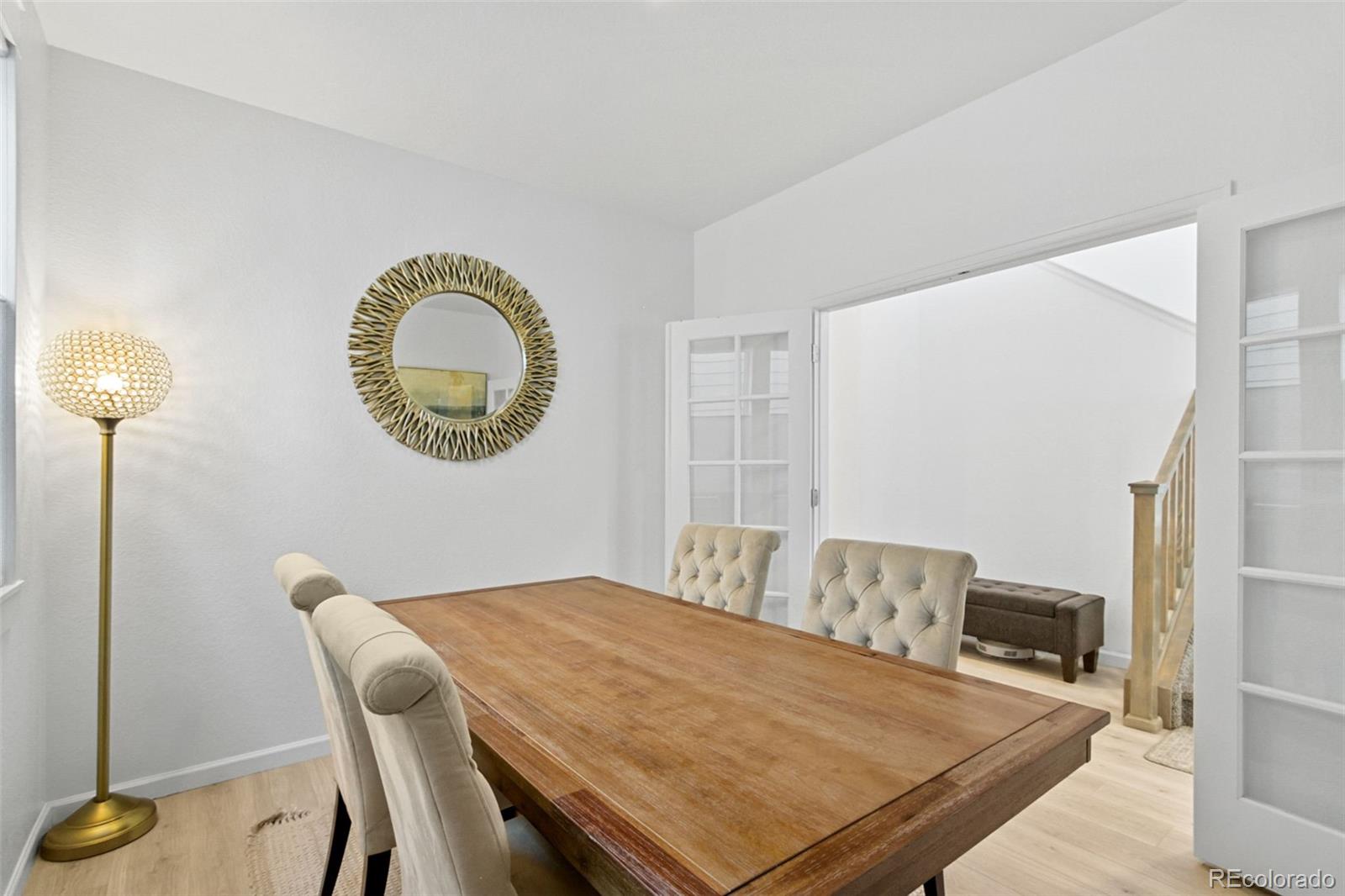 9753 Middle Peak Street Littleton, CO 80125 - Photo 18 of 41 a view of a dining room with furniture