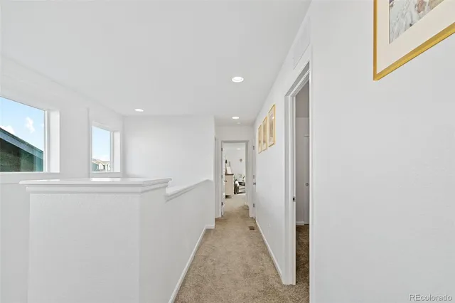 a bedroom with a bed and cabinets