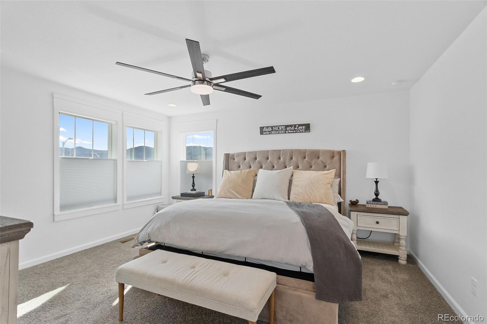 9753 Middle Peak Street Littleton, CO 80125 - Photo 30 of 41 a bedroom with a bed and window