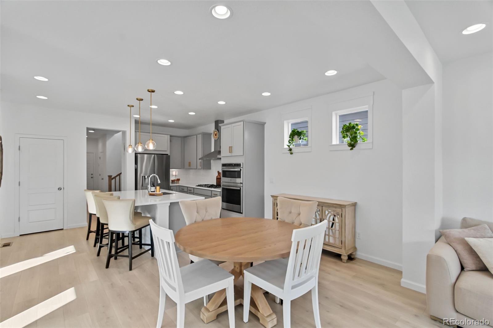 9753 Middle Peak Street Littleton, CO 80125 - Photo 5 of 41 a view of a dining room with furniture