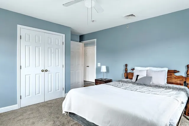 a bedroom with bed and window