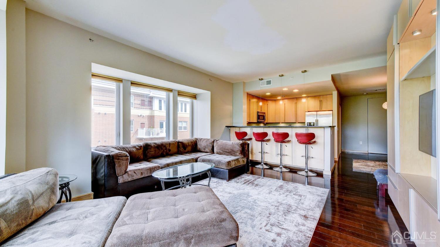 358 Rector Street, Unit 404 Perth Amboy, NJ 08861 - Photo 12 of 26 a living room with furniture and a large window
