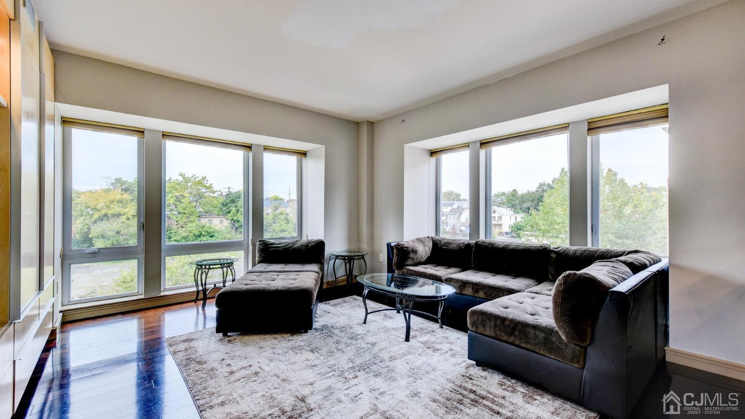 358 Rector Street, Unit 404 Perth Amboy, NJ 08861 - Photo 14 of 26 a living room with furniture and a large window