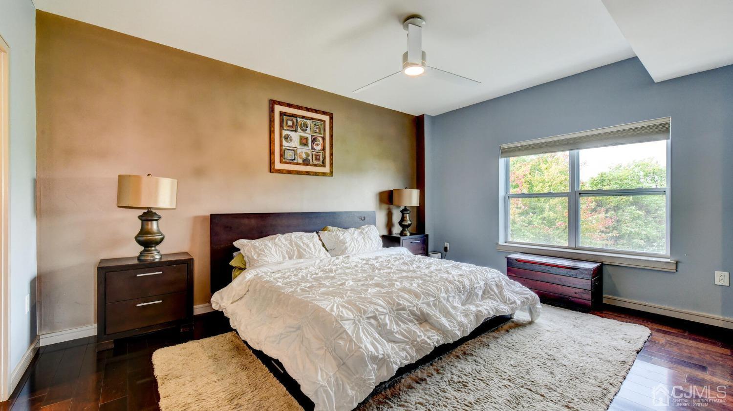 358 Rector Street, Unit 404 Perth Amboy, NJ 08861 - Photo 16 of 26 a bedroom with a bed and wooden floor
