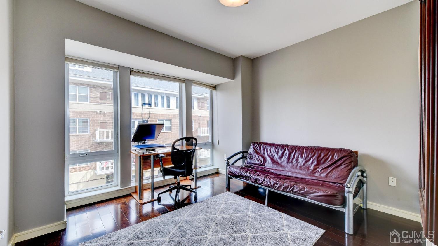 358 Rector Street, Unit 404 Perth Amboy, NJ 08861 - Photo 19 of 26 a living room with furniture and a window