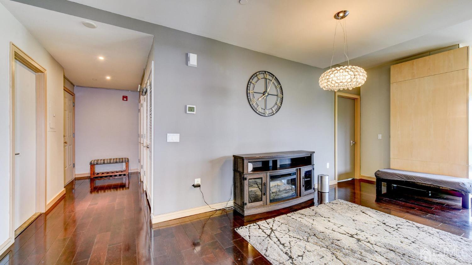358 Rector Street, Unit 404 Perth Amboy, NJ 08861 - Photo 5 of 26 a living room with fireplace furniture and a wooden floor