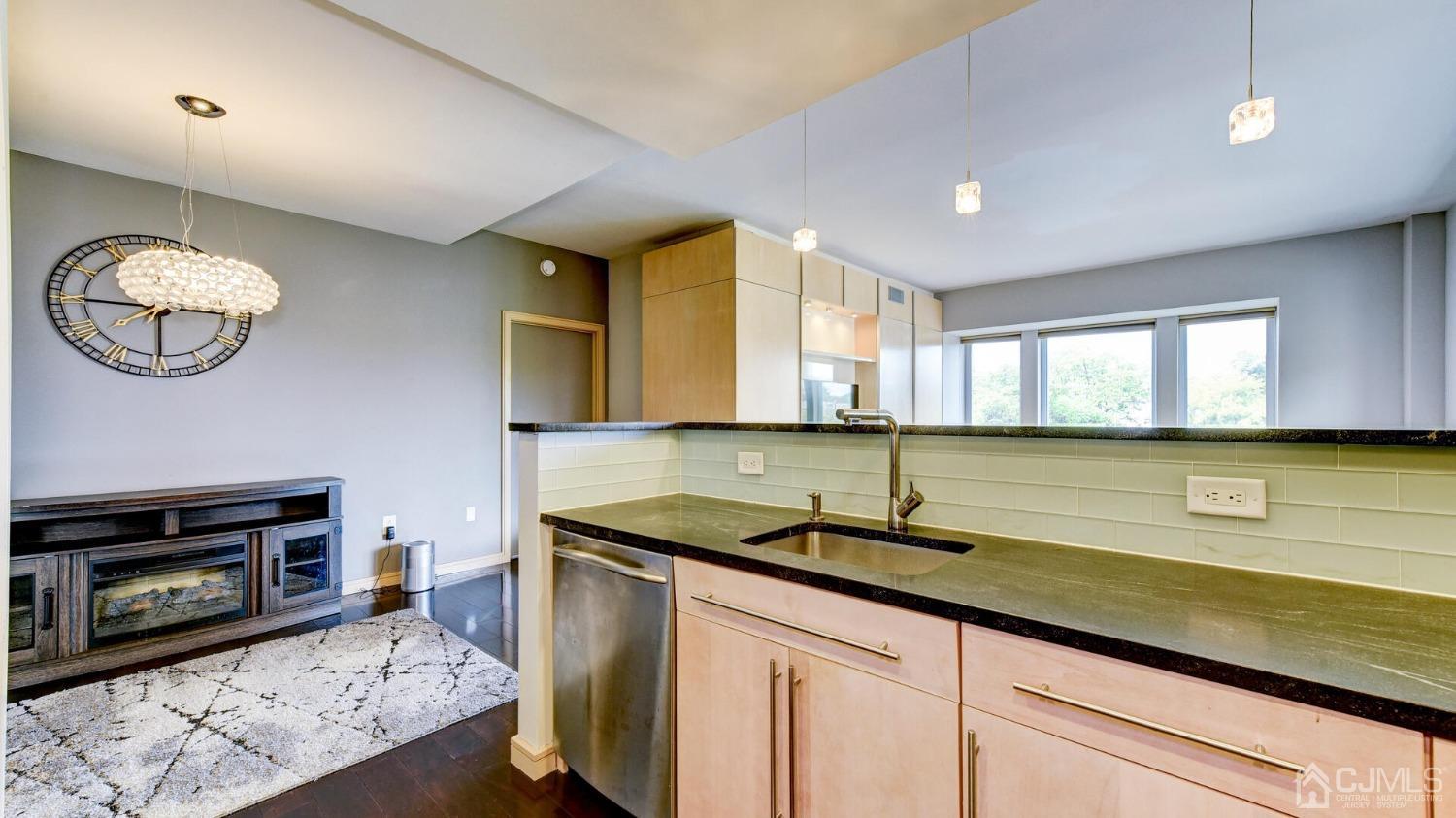 358 Rector Street, Unit 404 Perth Amboy, NJ 08861 - Photo 7 of 26 a kitchen with a sink cabinets and window