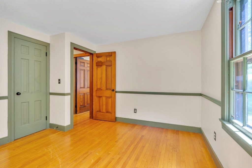 34 Crest Road Monson, MA 01057 - Photo 20 of 42 a view of an empty room with wooden floor and a window
