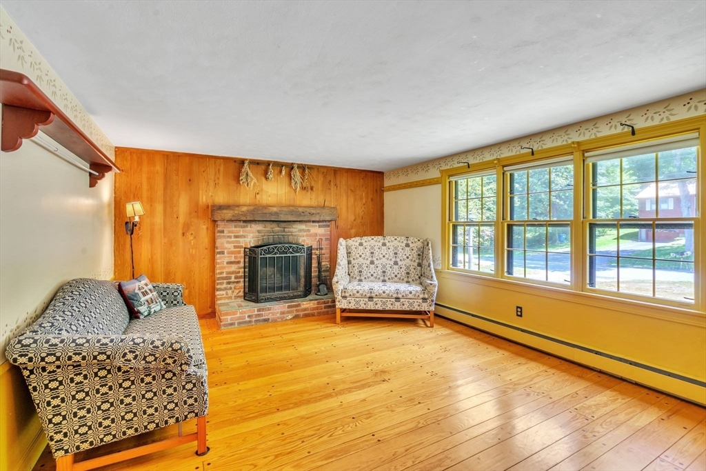 34 Crest Road Monson, MA 01057 - Photo 9 of 42 a living room with furniture and a fireplace